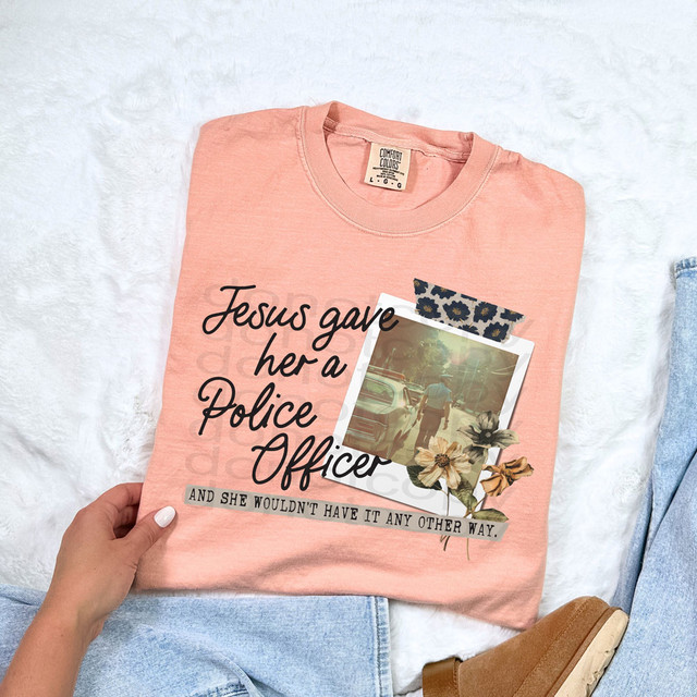 Jesus Gave Her A Police Officer DTF Heat Transfer, t-shirt with a quote and photo design of a woman walking near police cars.