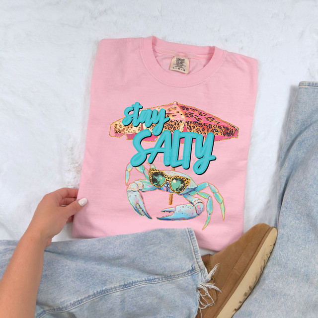 Stay Salty Crab DTF Heat Transfer, colorful crab illustration with sunglasses and umbrella on pink T-shirt.