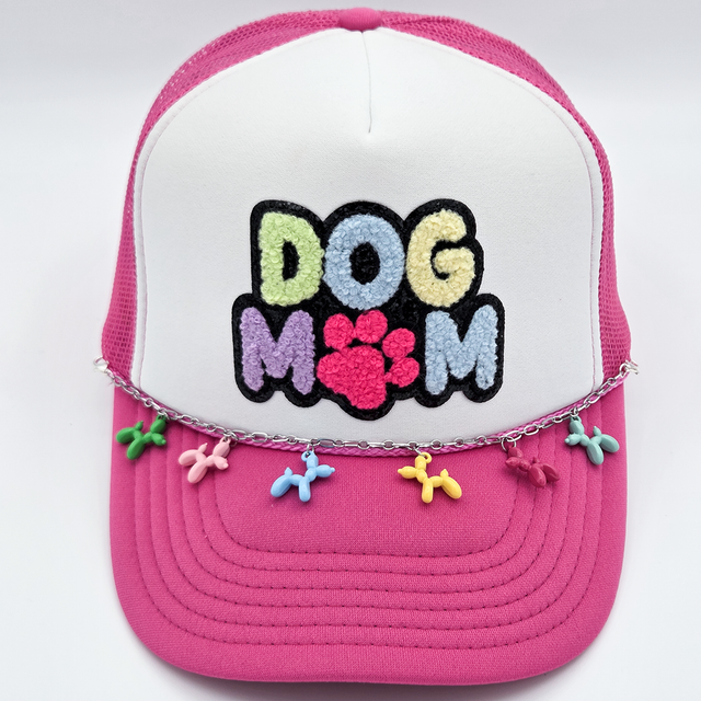 Balloon Dog Charms Hat Chain, a pink and white cap with embroidered "Dog Mummy" text and colorful dog-shaped charms.