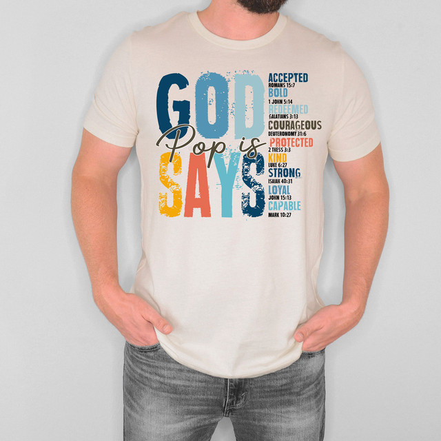 God Says Pop DTF Heat Transfer, colorful and bold text on a white t-shirt with religious messages and scripture references.
