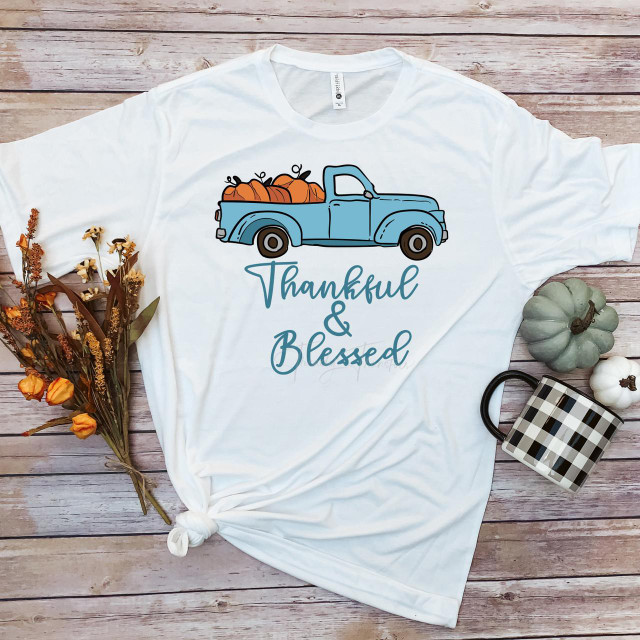 Blue Vintage Truck Pumpkins Thankful and Blessed Sublimation Transfer T-shirt with autumn-themed design on a wooden background.