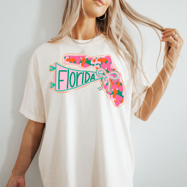Florida State Pride Bow DTF Heat Transfer, colorful Florida state map design with bow and camouflage pattern on a white t-shirt.
