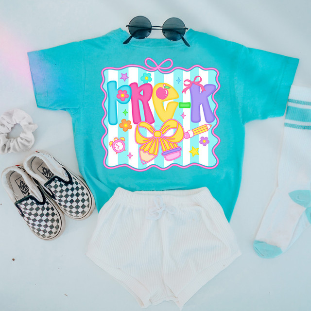 Back To School Coquette Bow DTF Heat Transfer, colorful graphic design on a blue t-shirt with sunglasses, white shorts, checkered sneakers, scrunchie, and socks with blue stripes.