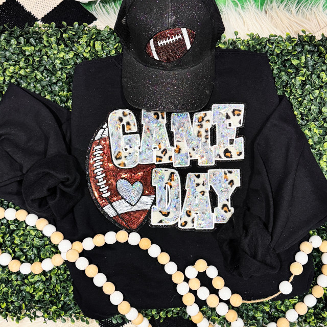 Silver Football Leopard & Sequins Patch, close-up of a black sweatshirt with a large sequined patch featuring a leopard print football and bold letter design.
