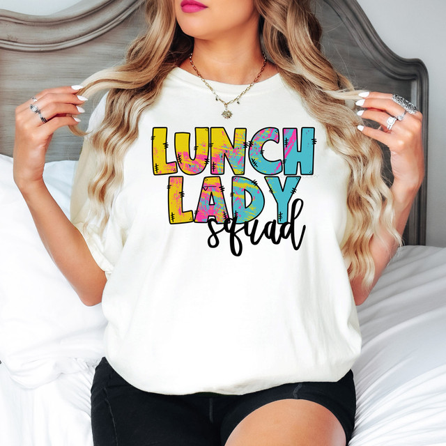 Lunch Lady Squad DTF Heat Transfer, colorful and playful graphic design on a white t-shirt with the text 'LUNCH LADY squad' in vibrant colors and bold fonts.