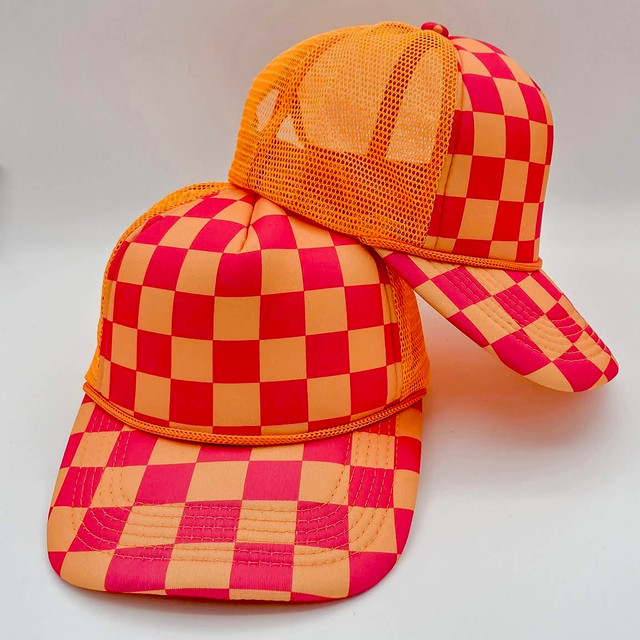 Neon Pink & Orange Checkered Foam Trucker Hat, stylish mesh front and adjustable brim with vibrant checkered pattern.
