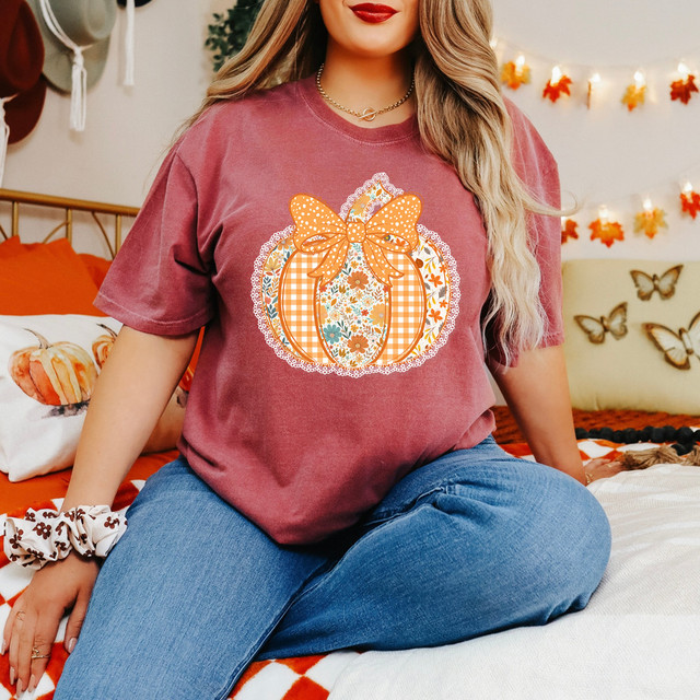 Faux Lace Patterned Pumpkin DTF Heat Transfer, illustrated pumpkin with lace-like faux lace pattern and a large bow in orange and white checkered design, perfect for fall and Halloween decorations.