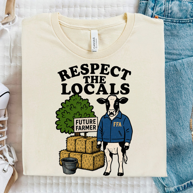 Respect The Locals Future Farmer DTF Heat Transfer T-shirt, featuring a cartoon cow in a blue jacket, hay bales, and a sign that reads 'Future Farmer' against a white background.