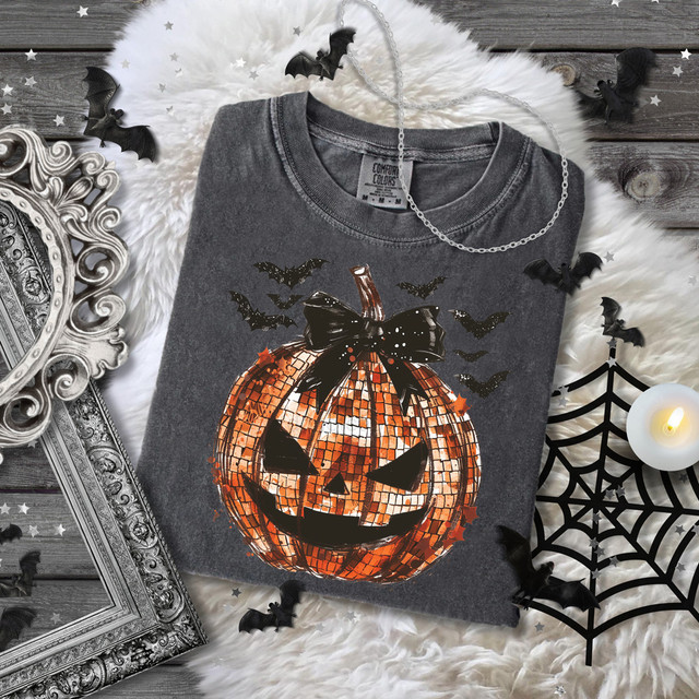 Disco Jack-O'-Lantern DTF Heat Transfer, Halloween-themed pumpkin with a mosaic pattern, black bow on top, surrounded by bats and spooky decorations.