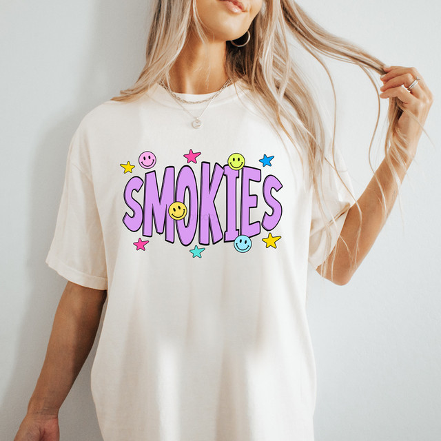 Smokies Happy Face DTF Heat Transfer, colorful smiley face graphic with text on a white t-shirt.