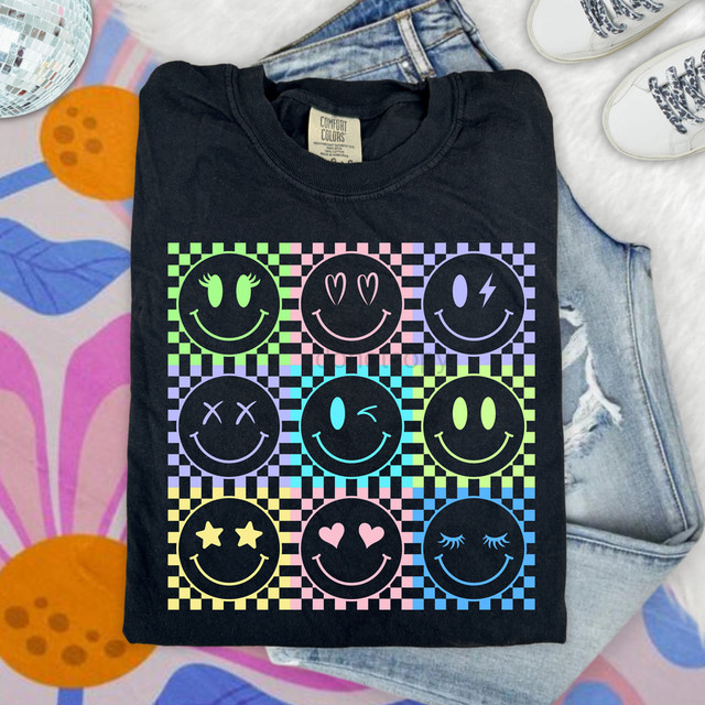Retro Checkered Happy Face DTF Heat Transfer, colorful smiley face graphic design on a black T-shirt.