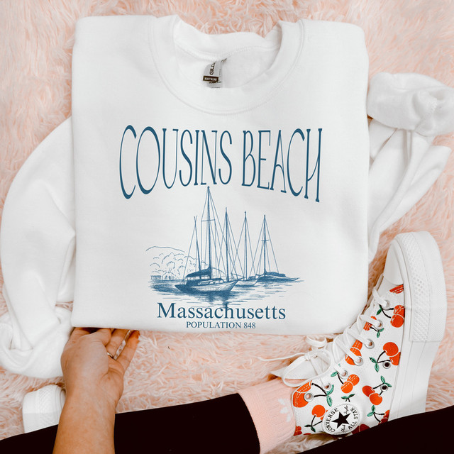 Cousins Beach Massachusetts DTF Heat Transfer, white sweatshirt with blue text and sailboat graphic, showcasing a scenic design of Cousins Beach in Massachusetts.