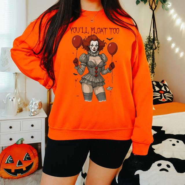 You'll Float Too DTF Heat Transfer, Halloween-themed orange sweatshirt with Pennywise the clown graphic design.