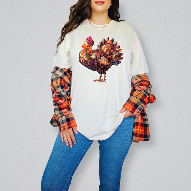 Disco Fall Turkey DTF Heat Transfer, colorful turkey design on a white T-shirt styled with a plaid shirt and blue jeans.