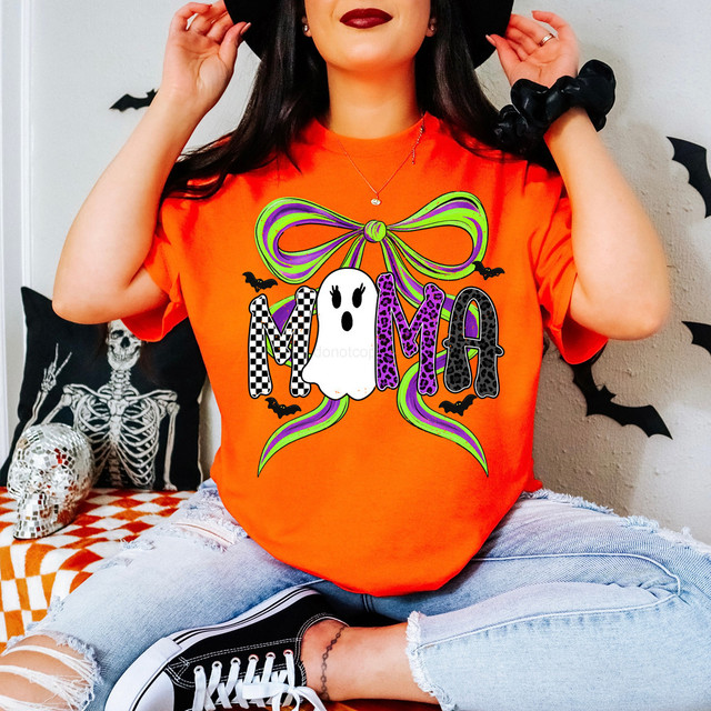 Mama Pattern Ghost Bow DTF Heat Transfer, colorful Halloween-themed design on an orange t-shirt featuring a bow, ghost, and bats.