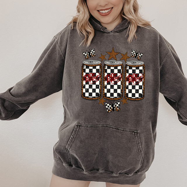 Checker Dr P Leopard Stars DTF Heat Transfer, three soda cans with leopard print and checker pattern design on a hoodie.