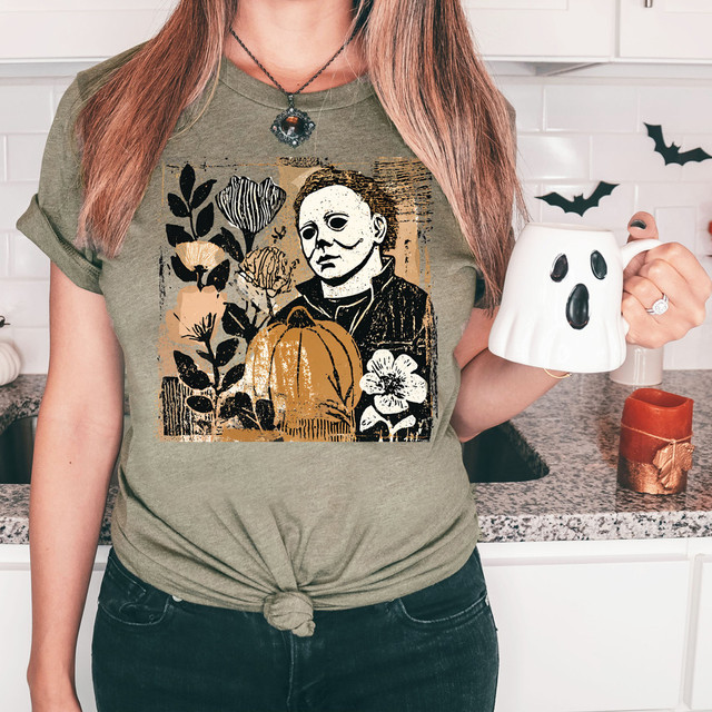 MM Floral Halloween DTF Heat Transfer, Halloween-themed floral design featuring a woman, pumpkin, flowers, and spooky elements on a t-shirt.