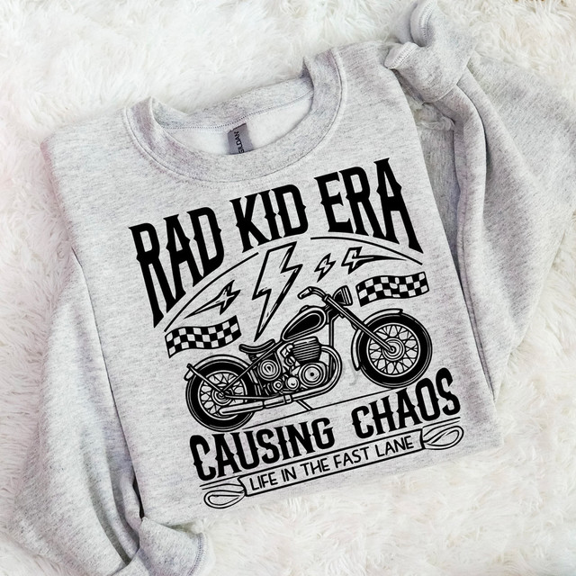 Rad Kid Era DTF Heat Transfer, graphic design of a motorcycle, lightning bolts, checkered flags, and racing elements on a grey sweatshirt.