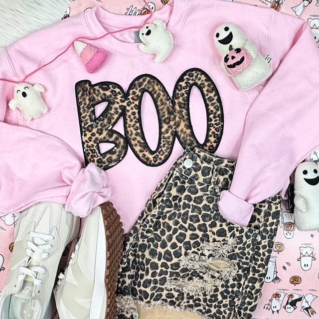 Leopard BOO Sequin Patch, pink sweatshirt with leopard print 'BOO' lettering and various Halloween plush toys and distressed leopard print jeans.