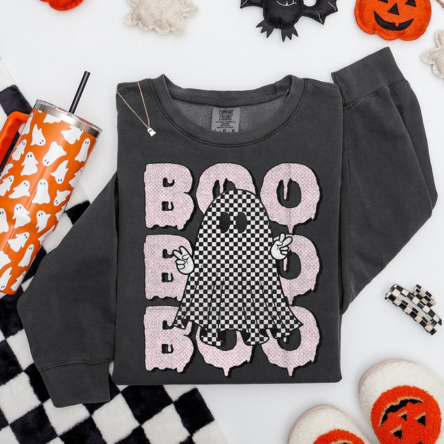 Boo Stacked Checkered Ghost DTF Heat Transfer, Halloween themed design with a ghost figure in checkered pattern and the word BOO in pink, on a dark gray sweatshirt.