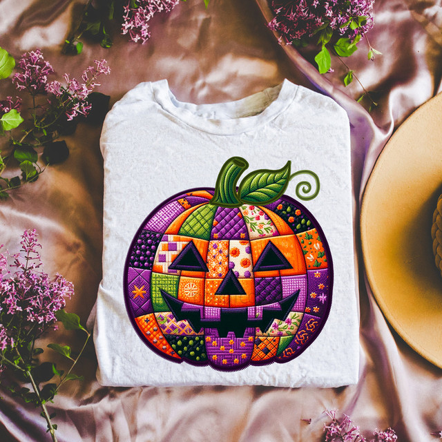 Patchwork Pumpkin Faux Embroidery DTF Heat Transfer, colorful halloween pumpkin design on a white t-shirt.