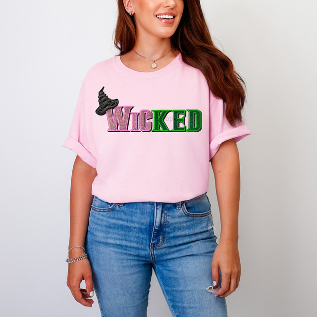 Wicked Faux Embroidery DTF Heat Transfer, colorful embroidered witch hat and the word Wicked on a pink t-shirt.