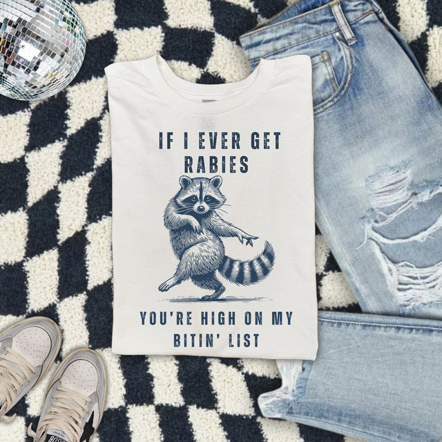 If I Ever Get Rabies Blue DTF Heat Transfer, humorous t-shirt with a raccoon graphic and text about being high on a bitten list.