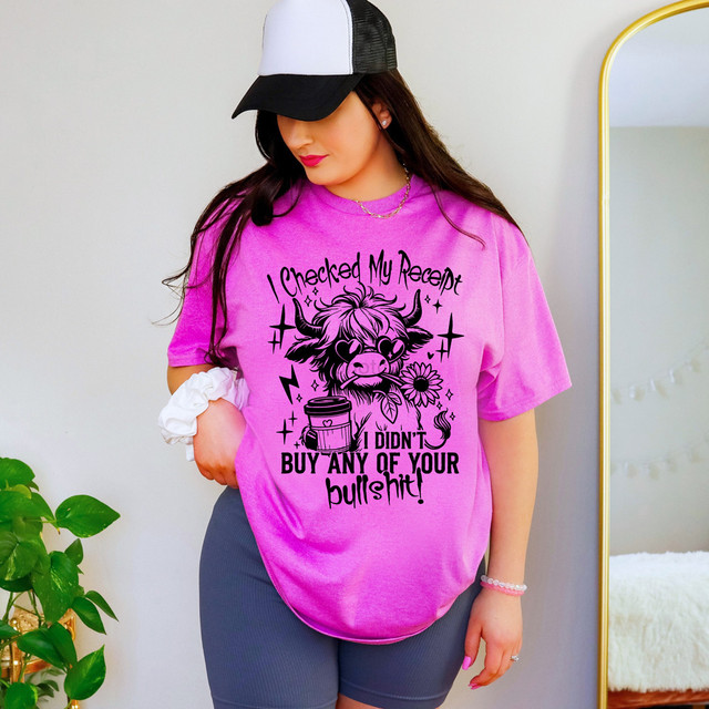 Checked My Receipt DTF Heat Transfer, pink T-shirt with a graphic of a cow and humorous text printed on it.