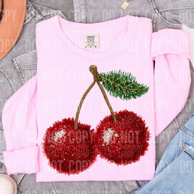 Faux Yarn Cherry DTF Heat Transfer, pink sweatshirt with cherry design featuring faux yarn texture and green leaf detail.