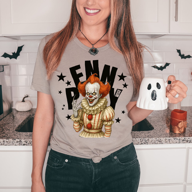 Clown Stars BLACK DTF Heat Transfer, spooky Halloween clown design on a gray T-shirt worn by a woman in a kitchen.
