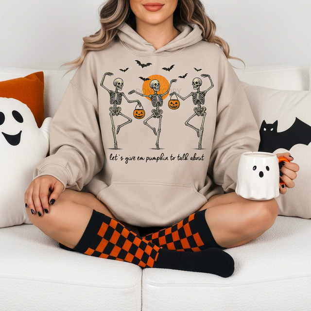 Let's Give 'Em Pumpkin to Talk About DTF Heat Transfer, Halloween themed hoodie with skeletons and pumpkins design.