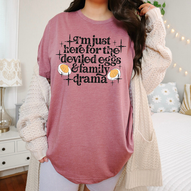 I'm Just Here For The Deviled Eggs & Family Drama DTF Heat Transfer, pink oversized T-shirt with humorous text and cartoon deviled eggs Illustration.
