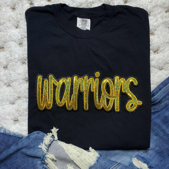Warriors Gold Sequins Patch, gold glittery sequins patch with the word 'Warriors' on a black T-shirt.