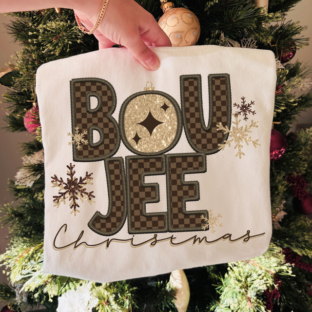 Boujee Christmas DTF Heat Transfer, embroidered white fabric with Christmas-themed design featuring the words 'BOU JEE' and 'Christmas' with snowflakes and a glittery ornament on a Christmas tree.