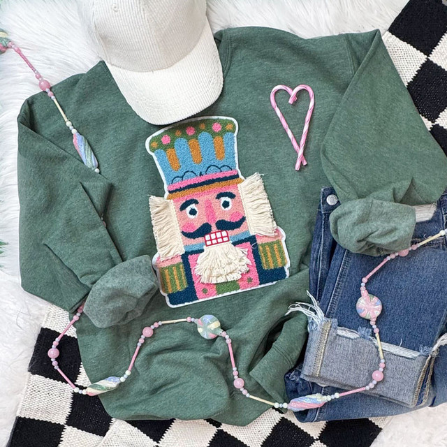 Yarn and Chenille Nutcracker Patch, decorative patch with a colorful nutcracker design and textured yarn and chenille embellishments.