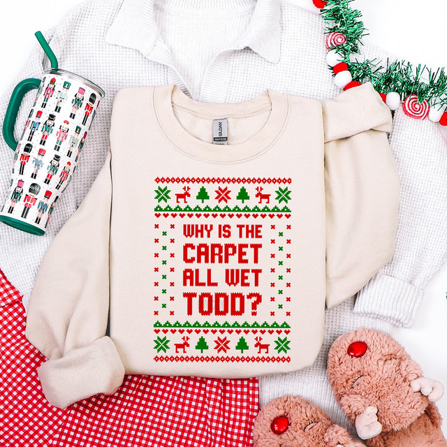 Why Is The Carpet Wet Todd? Sweater Pattern DTF Heat Transfer, Christmas-themed sweater with a humorous holiday design in red and green.