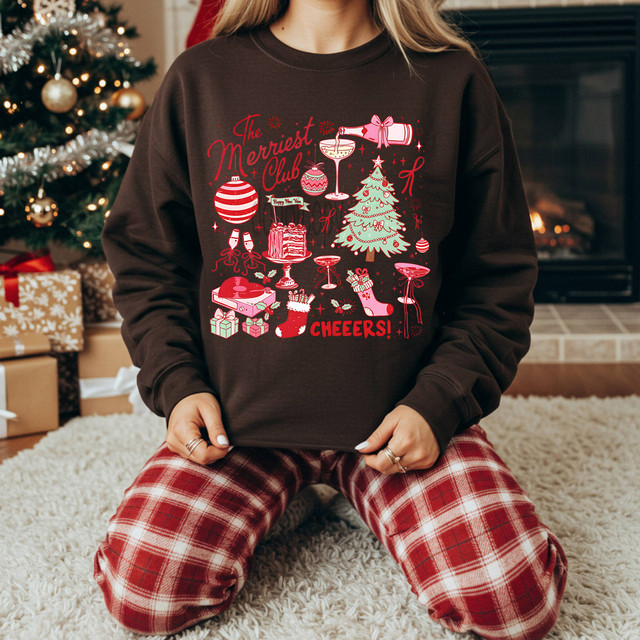 The Merriest Club DTF Heat Transfer, Christmas-themed holiday sweater featuring festive decorations and cheer.