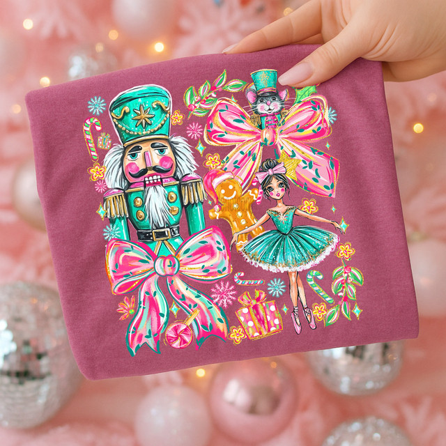 Nutcracker Collage DTF Heat Transfer, colorful and festive illustration of nutcracker, ballerina, and holiday-themed decorations on pink fabric.