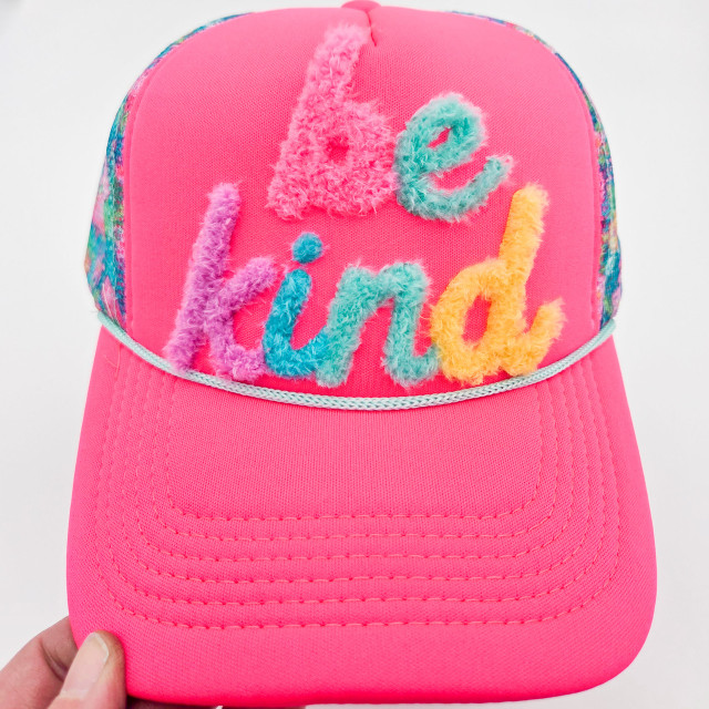 Be Kind Fluffy HAT Patch, colorful fuzzy embroidery spelling 'be kind' on a pink hat.