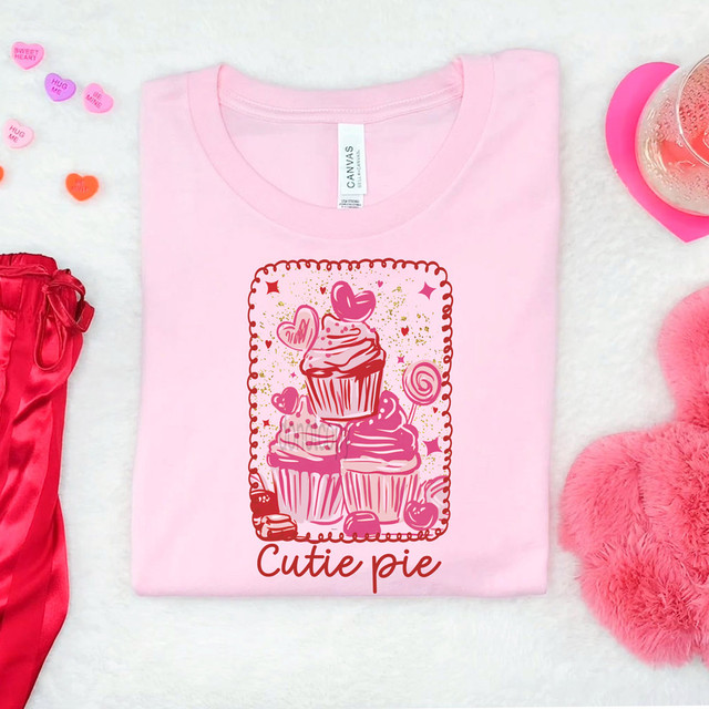 Cutie Pie Cupcakes DTF Heat Transfer, pink t-shirt with cupcake and heart graphic design.