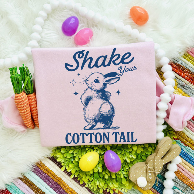 Shake Your Cotton Tail NAVY DTF Heat Transfer, pink fabric with a bunny illustration and text.