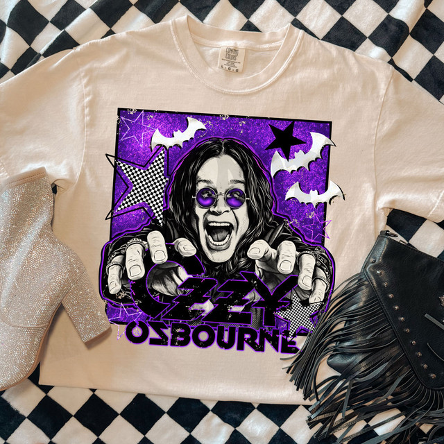 Oz Band Tee DTF Heat Transfer, colorful graphic T-shirt featuring a screaming woman with purple sunglasses, surrounded by stars, bats, and lightning bolts in purple, black, and white design.