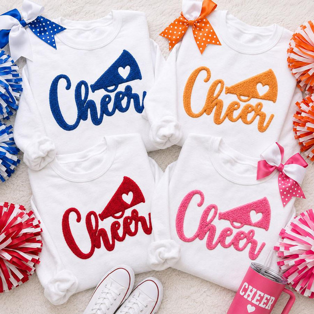 Cheer Fluffy Textured Patch - 4 Colors, colorful embroidered cheer patches on white sweatshirts with polka dot ribbons and pom-poms for cheerleading.