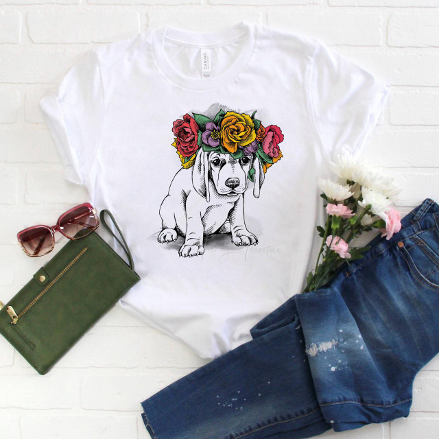 Boho Floral Puppy Sublimation Transfer, a graphic design of a cute puppy with a colorful flower crown on a white t-shirt.