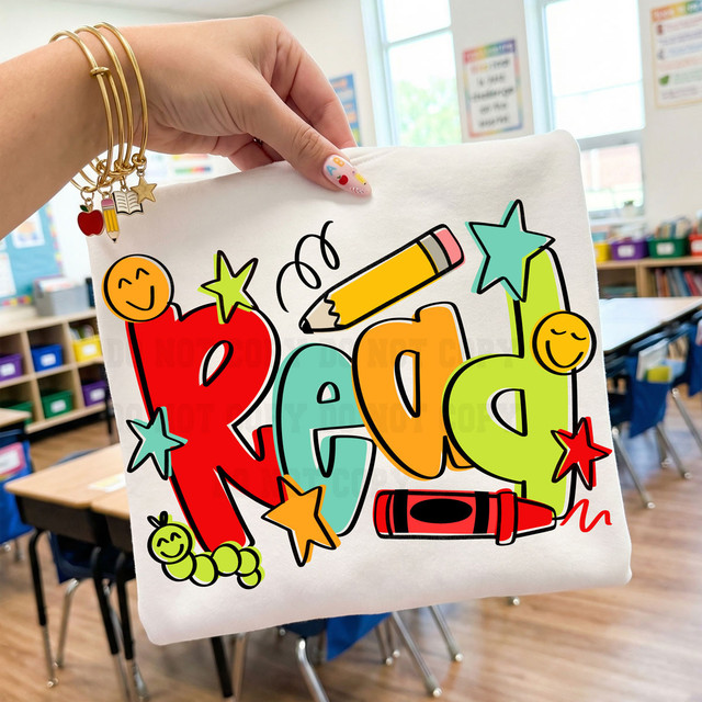 Product Colorful Read #2 DTF Heat Transfer, vibrant and colorful educational design on a white fabric tote bag with cheerful cartoon-style letters, stars, and smiley faces.