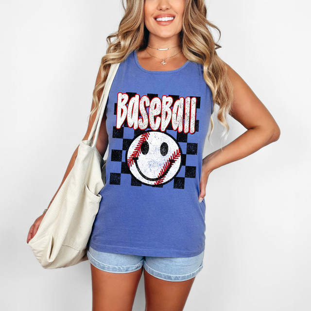 Distressed Baseball Happy Face DTF Heat Transfer, in this image, a woman wearing a blue tank top displaying the distressed baseball happy face DTF heat transfer design with the word 'baseball' and a smiling baseball graphic.
