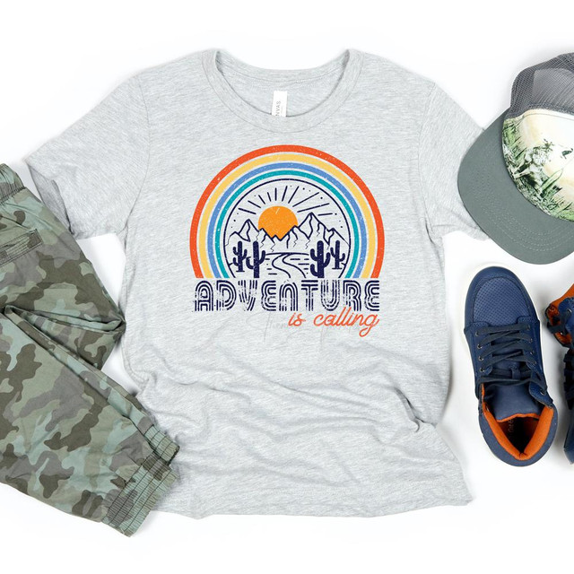 Adventure Is Calling YOUTH Screen Print Heat Transfer, graphic design featuring mountains, sunset, cactus, and rainbow on a light gray t-shirt.