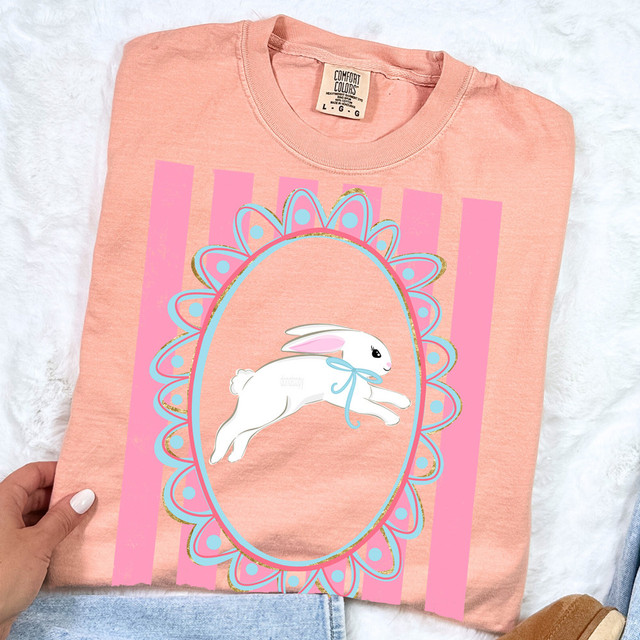 Easter Bunny Stripes DTF Heat Transfer, pink striped design featuring a white bunny with pink ears and a blue ribbon, inside an ornate oval frame with decorative patterns.
