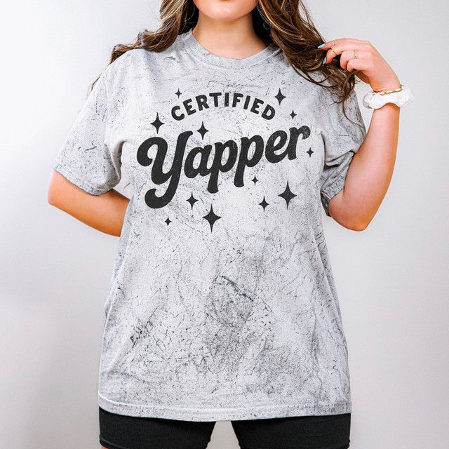 Certified Yapper BLACK DTF Heat Transfer, image of a woman wearing a heather gray t-shirt with 'Certified Yapper' graphic print.