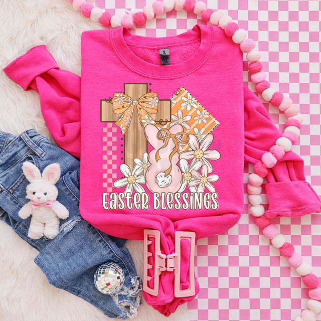 Easter Blessings DTF Heat Transfer, vibrant pink sweatshirt with Easter-themed graphic featuring a cross with a bow, bunny slippers, daisies, and the text 'Easter Blessings'.